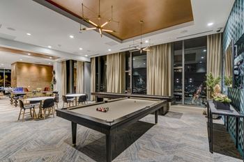 Penthouse-level lounge featuring billiards and shuffleboard